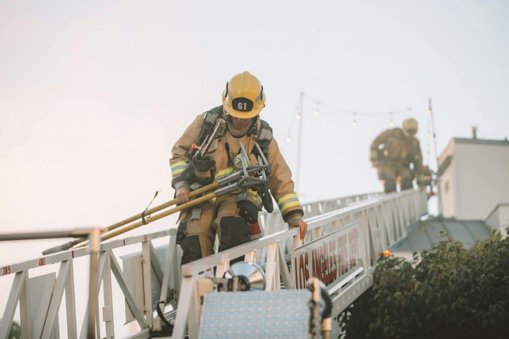 Fire Fighter Climbing a Ladder