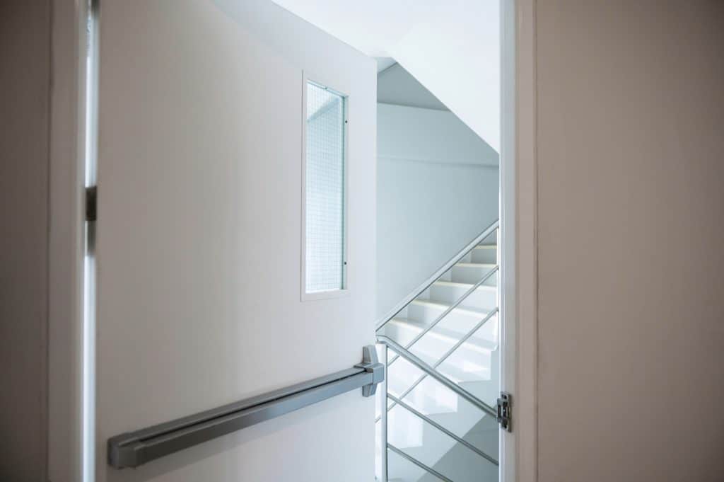 Stairwell fire escape behind the slightly ajar door